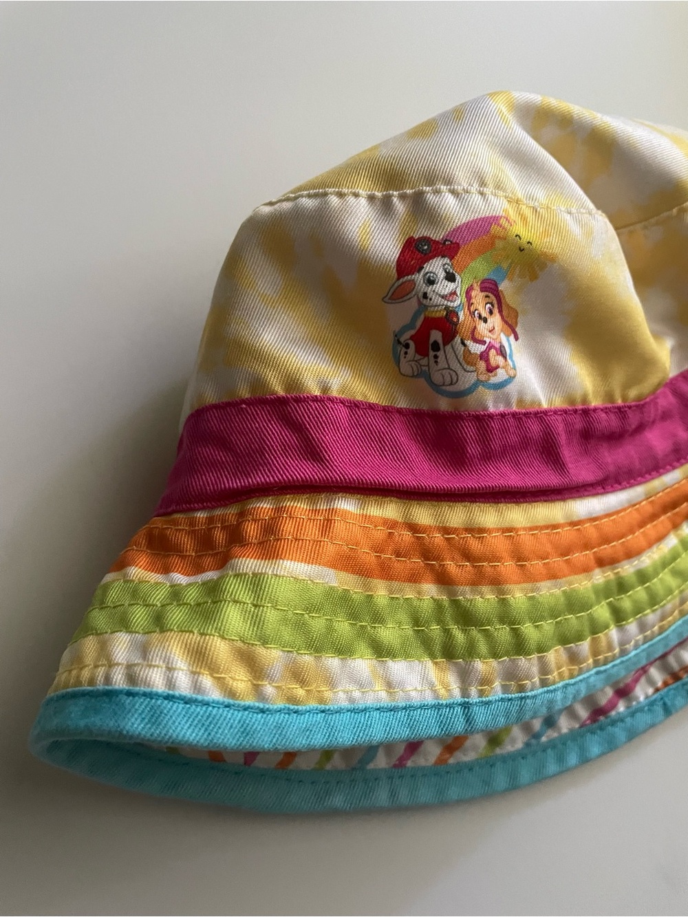 Paw Patrol Rainbow Stripe Reversible Bucket Hat in Yellow, Pink, Orange & Blue